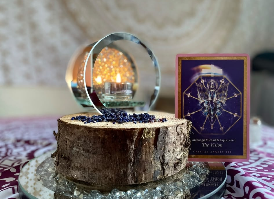 Candle, lapis chips and Archangel oracle card